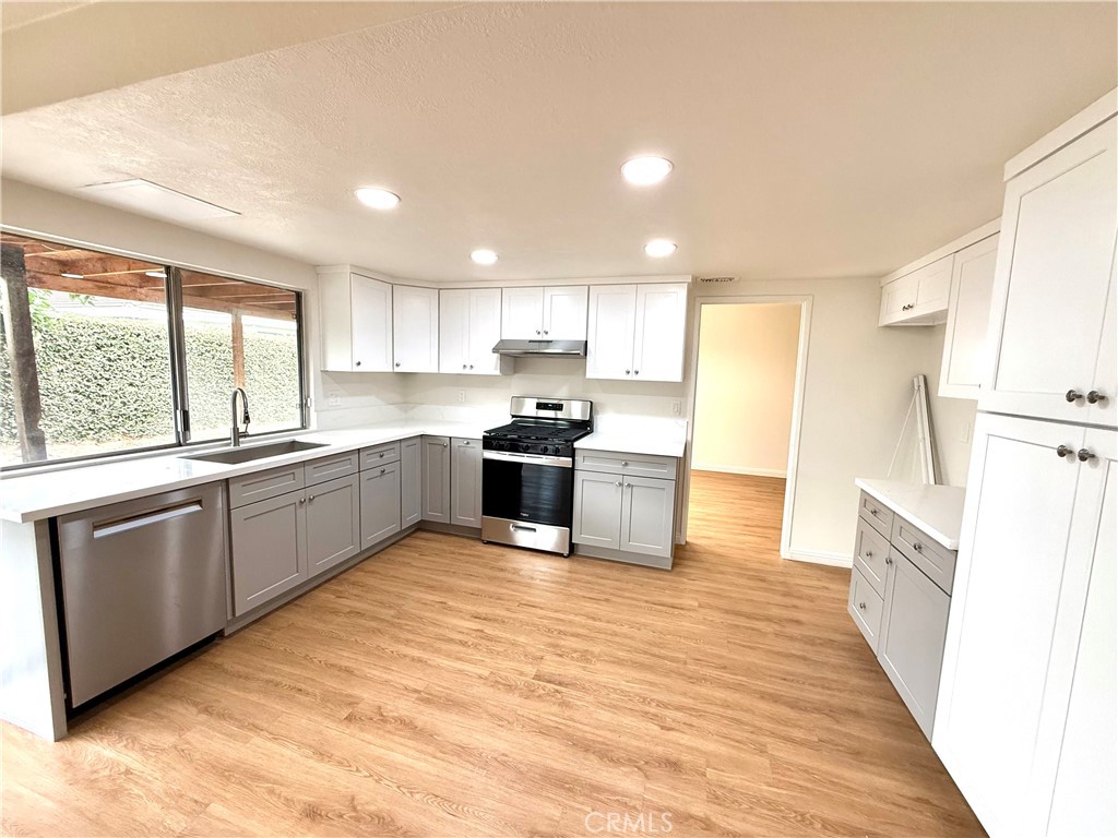 Fall in love with Cerritos living at 16417 Stowers! This spacious 2-story home on a serene cul-de-sac boasts a prime location with easy access to all the amenities Cerritos has to offer, including Olympic-size swimming pools, beautiful parks, and top-rated schools.
Step inside and be greeted by fresh new paint and carpet throughout. The formal dining room sets the tone for elegant gatherings, while the separate family room featuring a cozy fireplace creates a warm and inviting atmosphere.
You'll also appreciate the stunning new kitchen cabinetry in soft neutral colors, complemented by gorgeous quartz counters and brand-new stainless steel appliances including a dishwasher, oven, and stove. Perfect for culinary adventures!
With one bedroom and one bathroom conveniently located downstairs, this home provides flexible living options. Plus, enjoy the convenience of being within walking distance to Carmenita Junior High, Stowers Elementary, and Cerritos High School, as well as the Cerritos Library. Delight in nearby parks and Olympic-size pools, allowing you to embrace a lifestyle filled with recreation in the wonderful City of Cerritos!