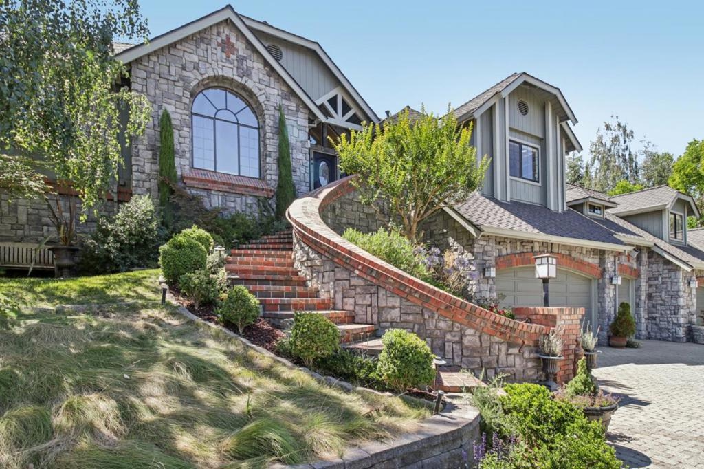 Come see this gorgeous estate! The main house features 4 spacious bedrooms and three baths, complemented by a charming GUEST HOUSE and a 5 CAR GARAGE. The home showcases a stunning architectural style with beautiful stone accents, adding to its charm and elegance. The expansive yard is an entertainers dream, featuring custom pavers, an inviting outdoor fireplace, a luxurious 8 person- jacuzzi, a shaded gazebo, and a sparkling pool. The guest house offers high vaulted ceilings, with plenty of natural light. It has its own private entrance and garage- ideal for guests, multigenerational living, or rental income. There is extensive parking available, a 5 car garage, enormous driveway with space to park trailer, boats and toys! The home is equipped with modern smart features, including thermostats, garage door openers, lighting, and switches, all designed for convenience and efficiency. For culinary enthusiasts, the gourmet kitchen is a dream come true, outfitted with top-of-the-line appliances including a Viking Professional range top and double oven, and a Sub-Zero refrigerator. With its combination of upgrades, timeless design, and thoughtful amenities, this residence is a must see.