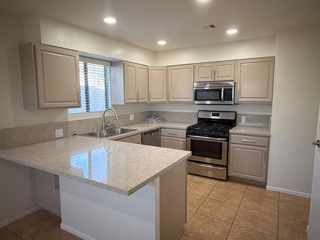 Move-in ready and updated 2 bedroom, 2 bath end unit features updated kitchen counter tops, fresh paint, new bathroom vanities, fixtures and more! Open floor plan features living room, kitchen with breakfast bar and dining area. Spacious bedrooms with mirrored wardrobes and ceiling fans. A small fenced backyard/patio offers privacy. Great views of the mountains to the north from living and dining.Close access to freeway, Acrisure Arena, the festivals in Indio, shopping, dining, golf and more!