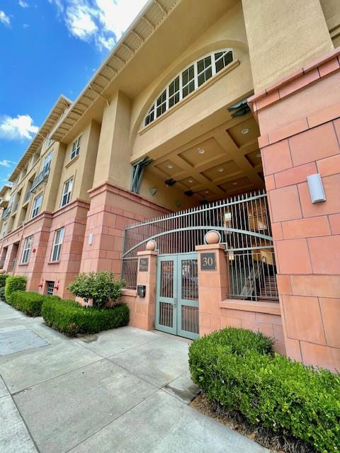 Conveniently located Downtown San Jose, just blocks from the San Pedro Market, public transportation, parks, restaurants and shopping. This condo has a fantastic floor plan and many desirable feature with a recently updated kitchen that offers plenty of cabinet space. Both bedrooms have brand new carpeting with large closets and the primary and secondary bathrooms have been gorgeously remodeled. Comfortable living room with gas fireplace and cozy balcony. Other features include A/C, HOA supplied hot water on demand and in unit washer / dryer. Gated entry. Two assigned parking spaces and one has its own dedicated EV charger. No pets, no smokers. One year lease to start. Deposit of $4,100. Proof of income - Last two pay period stubs or recent employment offer letter. Recent credit report w/FICO score. For utilities, tenant pays electricity only.