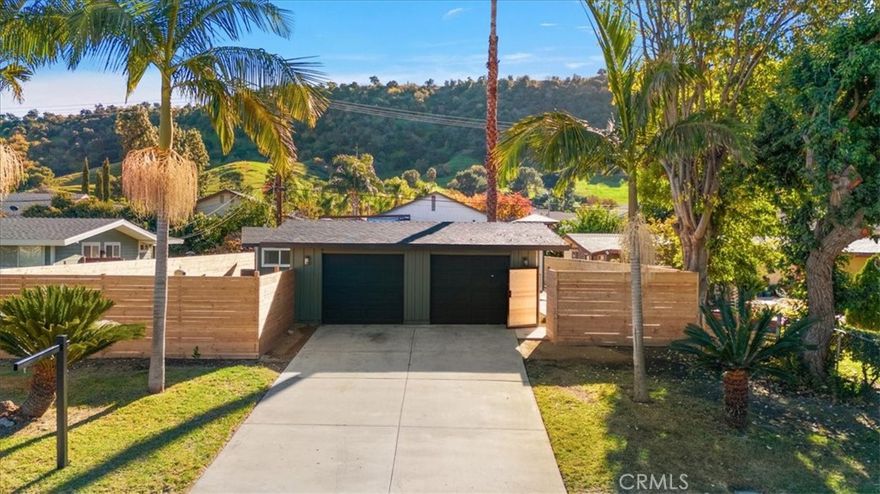 Welcome to Cliff May row at Wright St. in Pomona, a beautifully renovated 3 bedroom, 2 bath Mid Century Modern Cliff May ( Buyer to verify) home located in the highly desirable Westmont community, also known as the original Phillips Ranch. This architectural gem offers true indoor outdoor living with vaulted ceilings, an open floor plan, and expansive windows that fill the home with natural sunlight. some of the recent updates include roof, plumbing, recessed lighting, electrical panel upgrade, dual-pane windows, a new concrete entryway, and a new wood fence, the home blends classic style with modern comfort. The renovated kitchen features quartz countertops, and both bathrooms have been tastefully remodeled. Step outside to a private backyard oasis with a sparkling pool, mature palm trees, and a separate yard area away from the pool perfect for entertaining or providing additional space for kids and pets. Thes setting gives off calm vibes, creating a relaxing retreat at home. Located directly across the street from a park, school, and community center, this property offers a prime location in a family friendly neighborhood just west of the 71 freeway. This is a rare opportunity to own a turnkey Cliff May home in one of Pomona’s most sought after communities.