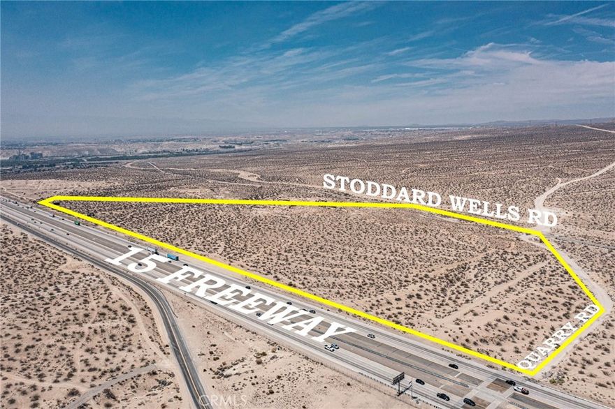Unlock the potential of this high-visibility, approx. 71.87-acre parcel located on Stoddard Wells Rd in Victorville. Strategically positioned along the I-15 Freeway near the proposed E-220 interchange, this property offers incredible long-term value for investors and developers alike. All required environmental studies for the E-220 project have already been completed and approved — saving you time and money. With direct access via Quarry Rd and exceptional exposure to northbound and southbound freeway traffic, this is a rare chance to secure a piece of land in the path of future infrastructure and regional growth. Buyer to verify zoning, utilities, and potential uses.