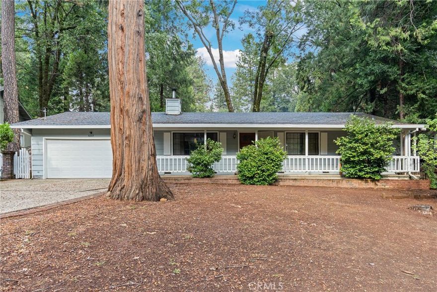 Pride of ownership shines in this 2-bedroom, 2-bath, 1,534 sq. ft. home located in the beautiful community of Magalia. Step inside to find stunning open-beam vaulted wood ceilings, a cozy wood-stove, and a spacious open layout. The large laundry/utility room offers extra convenience and storage. Outside, enjoy a fully fenced backyard complete with a storage room featuring a faucet and cabinets—perfect for an office, studio, or bonus space. A charming pond feature and concrete patio, accessible through the living room slider, make it ideal for outdoor entertaining. Nestled on a peaceful cul-de-sac, this home is move-in ready and full of charm.