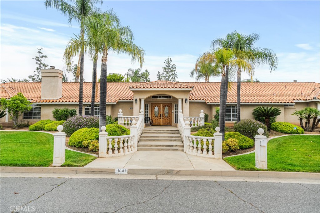 Welcome to this beautifully maintained 4,641 sqft home, perfectly designed for multi-generational living or luxury family comfort. Situated on a spacious half-acre lot. Featuring 5 spacious bedrooms , 4 bathrooms AND a dedicated office. Four of the bedrooms have connecting Jack & Jill bathrooms— proving ideal privacy for family and guests. The master suite offers direct access to the pool and backyard, providing a seamless indoor-outdoor living experience. The bathroom has been recently remodeled and features a large walk-in closet and a cozy fireplace, creating a luxurious and comfortable retreat.The versatile office space is perfect for remote work or study, while the residence’s three cozy fireplaces add warmth and charm throughout. Step outside to your private backyard oasis, complete with a fenced-in pool, lush landscaping, and plenty of room for outdoor entertaining or relaxation. The three-car garage provides ample parking, with additional space for guests or recreational vehicles. Additional highlights include a newer A/C unit for optimal comfort year-round and a convenient location near the prestigious Redlands Country Club. Easy access to the 10 freeway makes commuting a breeze. This exceptional home combines luxury, practicality, and style—ready to welcome your family today!