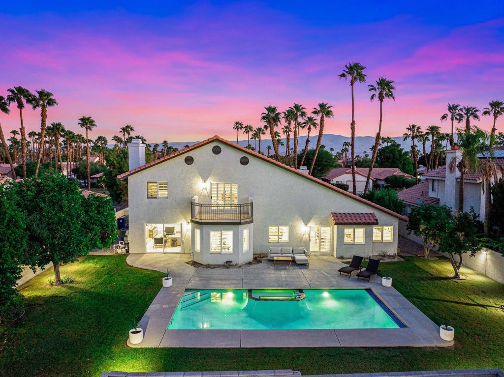 This completely remodeled and reimagined single-family home offers 2,793 square feet of modern living space with five bedrooms (PRIMARY & GUEST ARE DOWNSTAIRS) and three and a half bathrooms. Situated on a spacious lot of over a quarter acre in Regency Palms, it provides plenty of outdoor space to enjoy desert living at its best.No detail has been overlooked in the renovation. The home now features all-NEW bathrooms, a brand-NEW kitchen with NEW appliances, NEW flooring throughout, 2 NEW air conditioners, a NEW water heater, fresh NEW paint inside and out and a NEW pool heater .The floor plan is ideal for families or anyone who wants extra space. The PRIMARY suite is located on the MAIN FLOOR, offering convenience, privacy, and comfort. It includes a walk-in closet and a large spa-like bathroom with dual sinks, a separate shower, and a soaking tub. The open kitchen is a chef's dream, with stainless steel appliances, a gas stove, and a breakfast nook for casual dining. A separate formal dining area is perfect for hosting family and friends.Step outside to your private backyard retreat with mountain views, a heated pool, spa, and a built-in BBQ area--perfect for entertaining or unwinding after a long day. Additional features include a separate laundry room, central A/C, and a security system. All of this is located in a quiet Palm Desert neighborhood with excellent schools, just minutes from shopping and dining on El Paseo.