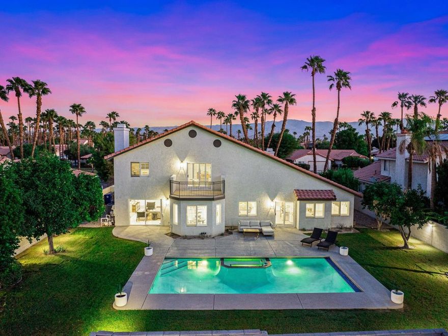 This completely remodeled and reimagined single-family home offers 2,793 square feet of modern living space with five bedrooms (PRIMARY & GUEST ARE DOWNSTAIRS) and three and a half bathrooms. Situated on a spacious lot of over a quarter acre in Regency Palms, it provides plenty of outdoor space to enjoy desert living at its best.No detail has been overlooked in the renovation. The home now features all-NEW bathrooms, a brand-NEW kitchen with NEW appliances, NEW flooring throughout, 2 NEW air conditioners, a NEW water heater, fresh NEW paint inside and out and a NEW pool heater .The floor plan is ideal for families or anyone who wants extra space. The PRIMARY suite is located on the MAIN FLOOR, offering convenience, privacy, and comfort. It includes a walk-in closet and a large spa-like bathroom with dual sinks, a separate shower, and a soaking tub. The open kitchen is a chef's dream, with stainless steel appliances, a gas stove, and a breakfast nook for casual dining. A separate formal dining area is perfect for hosting family and friends.Step outside to your private backyard retreat with mountain views, a heated pool, spa, and a built-in BBQ area--perfect for entertaining or unwinding after a long day. Additional features include a separate laundry room, central A/C, and a security system. All of this is located in a quiet Palm Desert neighborhood with excellent schools, just minutes from shopping and dining on El Paseo.