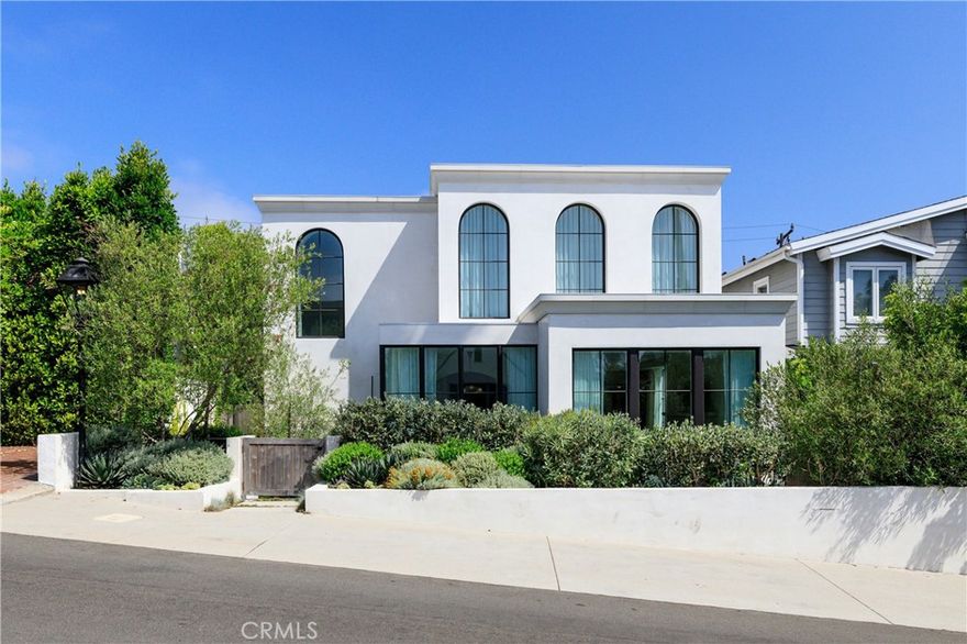 A Singular Modern Coastal Residence in Manhattan Beach. Step into a truly one-of-a-kind residence in Manhattan Beach’s prestigious Gas Lamp District, where refined European craftsmanship meets minimalist coastal living. Designed by the acclaimed architecture firm Laney LA and brought to life by the detail-driven team at Est. Collective, 515 Marine Avenue is a premier home that redefines luxury, design, and lifestyle in one of California’s most coveted beachside communities. Featuring serene, elevated interiors, this architectural showcase sits just blocks from the ocean while offering a rare sense of privacy and calm. From the moment you enter, you’re welcomed by dramatic architecture, soft natural light, and a warm, organic palette. Sleek microtopping concrete floors ground the interiors, while sculptural forms and rich textures create an environment of effortless sophistication. At the heart of the home is a chef’s kitchen adorned with Arabescato Vagli marble and anchored by a showstopping 71” Lacanche range. The immersive spatial design wraps around a private interior courtyard, creating the ultimate indoor/outdoor sanctuary where the kitchen, living, and dining areas blend seamlessly. Sliding glass doors and a custom firepit bring the courtyard to life—perfect for gatherings or tranquil daily living. Living areas flow naturally from one to the next, featuring a French 19th-century limestone mantel in the living room and a three-sided glass fireplace in the family room. A striking powder room downstairs reveals Portola Roman clay walls, an oversized sink, and sliding doors that open to a lushly landscaped outdoor shower. A ribbon-like staircase unites all levels with graceful continuity. Upstairs, wide-plank bleached oak floors lead to a peaceful primary suite, where abundant sunlight and calm create a true retreat. The bedroom opens fluidly to a spacious ensuite bathroom and a walk-in closet of rare scale, spanning 225 sq ft. Additional amenities include two outdoor showers, an upper-level deck, built-in 40” Lion stainless steel gas grill, integrated Sonos sound system, and curated fixtures such as Baldwin hardware and dark bronze aluminum windows with custom drapery—each selected to reflect a timeless, minimal aesthetic. Featured in The New York Times, Seattle Times, Martha Stewart Living, and Beta-Plus Publishing’s World’s Best II, 515 Marine is more than a home—it is a recognized design icon and a rare opportunity in the Manhattan Beach market.