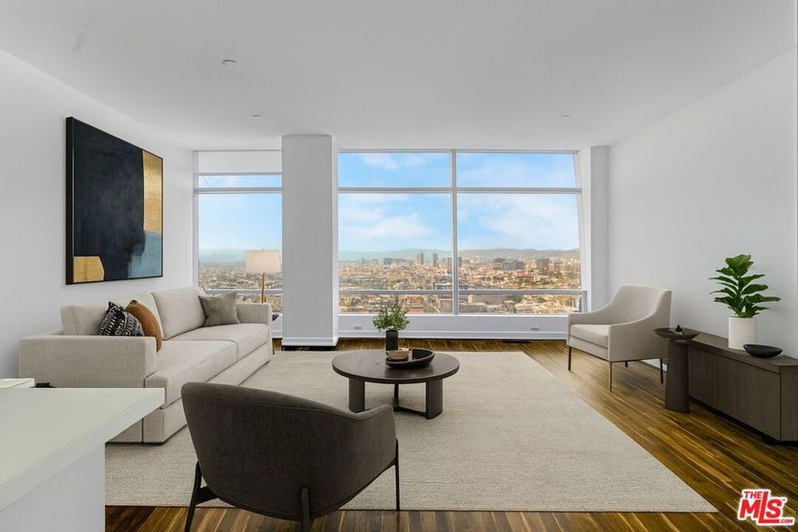 Best priced two bedroom in the building. Rare find at The Ritz Carlton Residences at LA Live. Unit 32D features jaw-dropping unobstructed west head-on views of the ocean and hollywood hills. One of the best two-bedroom floor plans in the building with a den great for an office, a chef's open kitchen with premium Gaggenau appliances, and custom Snaidero walnut cabinetry, the primary suite features a stunning luxurious bathroom with a whirlpool tub with a window to gaze at the view and generous walk in closet. A powder by the entrance for your guests. Your home away from home or a Pierre de Terr for a demanding buyer. Luxury living at its finest with hotel-style amenities, including a rooftop saltwater swimming pool and bar, spa, fitness center, theater, conference room, doorman, 24/7 security, room service, weekly continental breakfast, guest parking with valet, and much more. Featuring two parking spaces, and storage. Steps to restaurants and entertainment in Downtown LA where one can work and play.