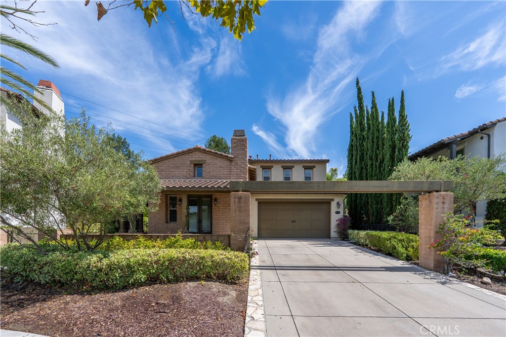 Now available for lease behind the prestigious gates of Covenant Hills, this luxurious Spanish-style estate offers the perfect blend of elegance, privacy, and resort-inspired living. Situated on a generous cul-de-sac lot with serene hillside vistas, this residence is meticulously crafted to provide both comfort and sophistication.
With over 3,200 square feet of living space, the home welcomes you with a dramatic two-story foyer and distinctive architectural details, including a wraparound covered porch ideal for gatherings or quiet relaxation.
The main level showcases Italian tile flooring, a wrought-iron staircase, designer lighting, and a built-in wine closet. At the heart of the home is a chef’s dream kitchen—complete with a granite center island, GE Monogram appliances, built-in refrigerator, double ovens, gas cooktop, warming drawer, and heat lamps—perfect for everyday meals or entertaining. The adjoining family room features a custom fireplace surround and pre-wired ceiling speakers for a true surround sound experience.
Indoor-outdoor living is seamless, with direct access to a private courtyard and manicured backyard framed by breathtaking hillside views—creating a tranquil retreat for year-round enjoyment. Additional features include a formal dining room, formal living room, Versailles-pattern tile flooring, two fireplaces, custom window treatments, and a spacious 3.5-car garage.
The home offers four bedrooms, including one on the main level, plus a lavish upstairs primary suite with a spa-inspired bath featuring dark wood vanities, marble countertops, and a luxurious marble shower.
This estate presents a rare opportunity to lease a timeless Spanish residence with modern amenities in one of Ladera Ranch’s most coveted communities.