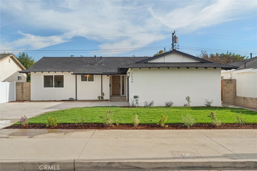 Welcome to 2534 E Hoover Avenue—an exceptional single-story home that has been completely remodeled inside and out, blending modern design with a prime Orange location. This 4-bedroom, 2-bathroom residence offers 1,645 square feet of bright, open living space on a 6,271 square foot lot.
Step inside to discover a spacious open-concept layout enhanced by brand-new luxury vinyl plank flooring, fresh recessed lighting, and an abundance of natural light. The designer kitchen serves as the centerpiece of the home, featuring sleek quartz countertops, new cabinetry, and stainless steel appliances—perfect for everyday living and entertaining. Both bathrooms have been tastefully renovated with stylish, contemporary finishes, giving the home a fresh, move-in ready appeal.
Additional highlights include new interior and exterior paint, new sod grass with a sprinkler system for easy upkeep, and thoughtfully chosen finishes throughout. The backyard provides plenty of space for outdoor dining, gardening, or relaxing under the California sun, while the long driveway and attached garage offer ample parking and storage.
Located in one of Orange’s most desirable neighborhoods, this home places you near top-rated schools, parks, and just minutes from the charm of Old Towne Orange with its historic architecture, dining, and shopping. With quick access to the 55, 57, 22, and 91 freeways, as well as local attractions like Disneyland Resort, Angel Stadium, and Chapman University, this remodeled home offers both comfort and convenience in one perfect package.