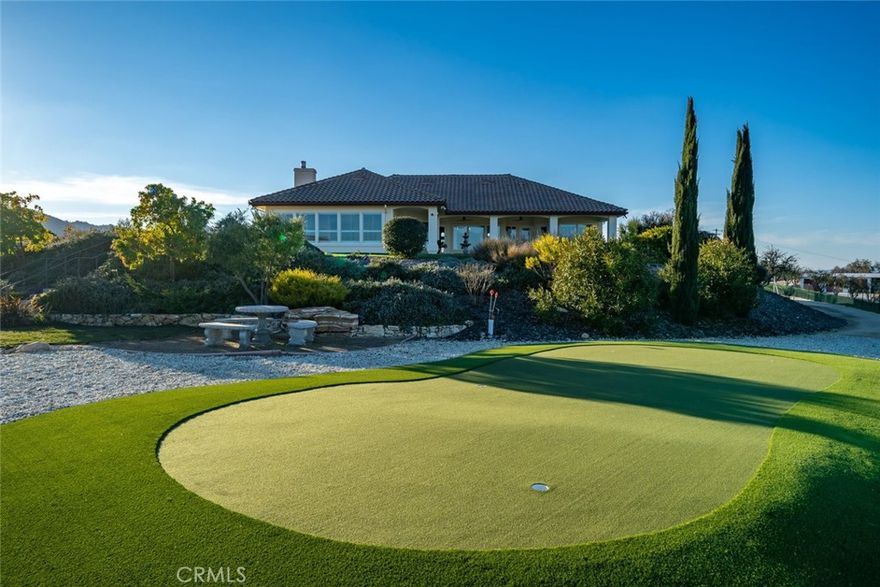 This extraordinary westside legacy estate, just 10 minutes from charming Paso Robles, spans 83 acres of pristine countryside, offering a rare blend of luxury, privacy, and breathtaking 360-degree views. A highly coveted retreat, this remarkable property features a stunning Spanish-style residence, an unrivaled pool house, and a wealth of premium amenities, and is situated in the heart of our award-winning wine country. Perched at the highest point of the estate, the main home is approximately 3000 sq ft of open floorplan and exudes sophistication with 3 large bedrooms, an office, and 3 well-appointed bathrooms. Vaulted ceilings, exposed beams, and custom plantation shutters show timeless elegance, while high-end cabinetry, top-tier appliances, and an open-concept design cater to those who love to entertain. The chef's kitchen comes with Jenn-Air cooktop and doubles ovens, and a large pantry. Additional features include a whole-house water filtration system and an advanced air scrubber HVAC system for high air quality. At the heart of this estate lies an unparalleled 3,200 sqft pool house—an architectural masterpiece designed for both relaxation and entertainment. Encased by high-end windows and doors, this space is complete with two heated pools—one a striking visual centerpiece and the other crafted for therapeutic use. Enhancing the experience is a new putting green, an outdoor shower, and a luxurious outdoor kitchen with a BBQ and bar area and built-in heaters. With a fireplace, 2 powder rooms, changing rooms, indoor shower and a washer and dryer, this show-stopping retreat is designed for hosting unforgettable gatherings. There is private owned solar field ensuring energy efficiency and sustainability. The estate offers two additional private mobile homes (1809 & 2335 sq ft), each with its own gated entrance, providing opportunity for multi-generational living, guest accommodations, or rental income. Additional features further elevate this estate’s appeal, including a 1,800 sqft insulated steel shop with three bays and roll-up doors, ideal for projects, or agricultural use, and comes with an additional 900 sqft open bay. The 83 acres are agriculturally zoned, gently rolling in nature and are currently covered in blooming almond trees. The trees are not income producing, however, they add visual splendor. The acreage is totally fenced. This estate is a legacy property—a multi-generational retreat or a private sanctuary with limitless possibilities.