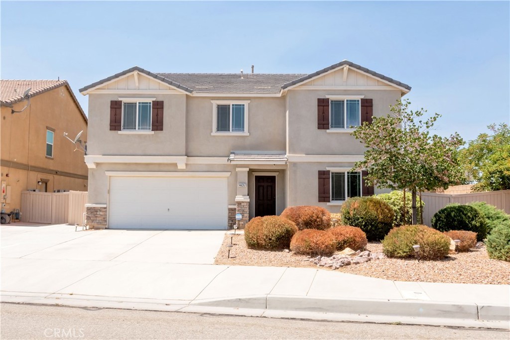 Paid-off solar means big savings on energy bills in this spacious 5-bedroom, 3-bath home! Features include an additional loft, convenient upstairs laundry, and a desirable downstairs bedroom with full bath—perfect for guests or multigenerational living. Situated on a corner lot with plenty of space to create RV parking. Enjoy the over-sized driveway, offering ample parking for family and friends. This move-in ready home has the space, comfort, and efficiency you've been looking for!
