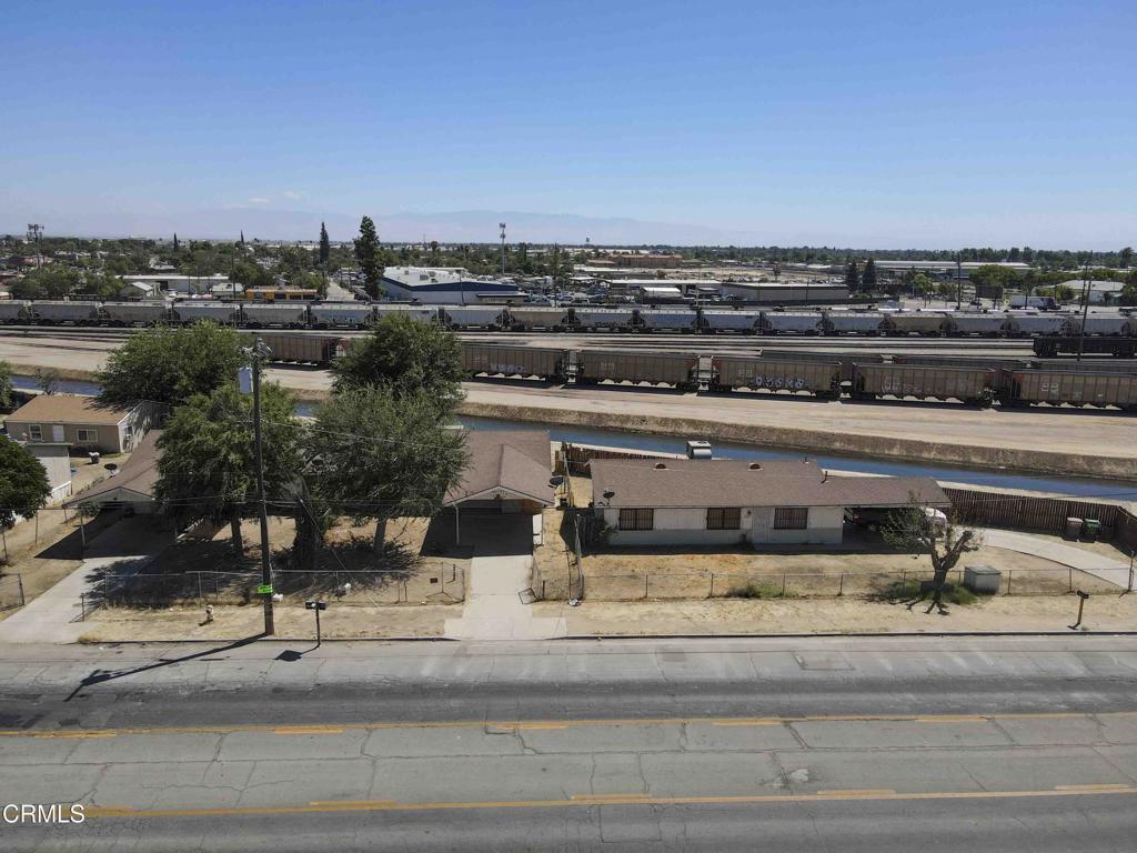 Just Reduced by $15,000!! East Bakersfield triplex consists of three large identical units with covered parking. All units have 3 bedrooms, 1.75 bathrooms and are approximately 1,000 sf. One is detached and the other two are attached. The middle unit is undergoing an interior remodel but is to be sold as-is which is reflected in the price. The other two units are rented. Great opportunity to build sweat equity while collecting rent!