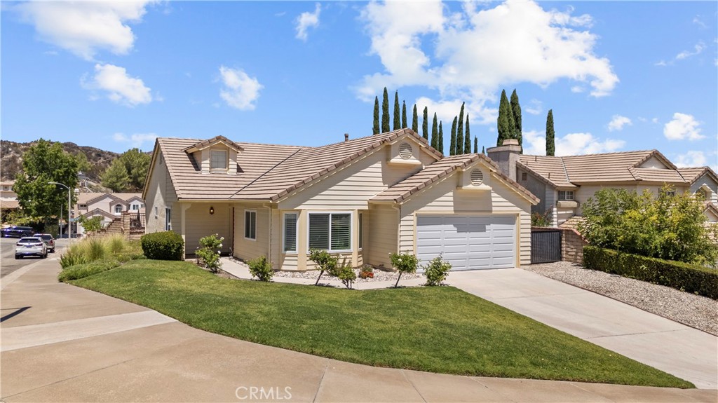 Charming Castaic Single-Story Home – Minutes from the Lake! Welcome to this beautifully maintained 3-bedroom, 2-bathroom single-story gem in the heart of Castaic. Step into the updated kitchen featuring sleek quartz countertops, crisp white cabinetry, a classic subway tile backsplash, and a charming bay window that fills the space with natural light. Enjoy the comfort of both a formal living room and a separate family room—perfect for entertaining or relaxing. All three bedrooms are generously sized, and the attached garage offers added convenience with potential for boat parking. The backyard is a peaceful retreat with a grassy lawn, blooming garden area, and vibrant flowers—a great space to unwind or entertain. Located just minutes from Castaic Lake, Castaic High School, and the 5 Freeway, this home offers the ideal blend of tranquility and accessibility. No HOA to worry about—just easy everyday living!