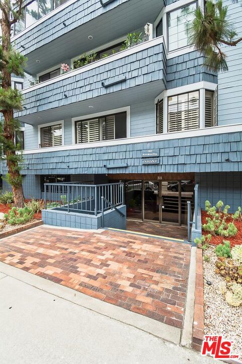 Fabulous Coastal Living Just Minutes to the Beach! Welcome to this west-facing 2-bedroom, 2-bath condo located just minutes from beaches, the harbor, shops, and dining. Situated on the second level, this spacious home features an open floor plan that's perfect for entertaining. Enjoy the charm of a cozy fireplace, a built-in wet bar, and a sunny atrium off the kitchen breakfast nook. The formal dining room opens to a private enclosed patio, ideal for relaxing or dining al fresco. The updated primary bath boasts a separate shower and soaking tub for a spa-like retreat. Additional highlights include in-unit laundry, secure gated entry, and community garage with bike storage. Resort-style amenities include a pool, spa, fitness center, and tennis courts. Don't miss this opportunity to live the coastal lifestyle in comfort and style!