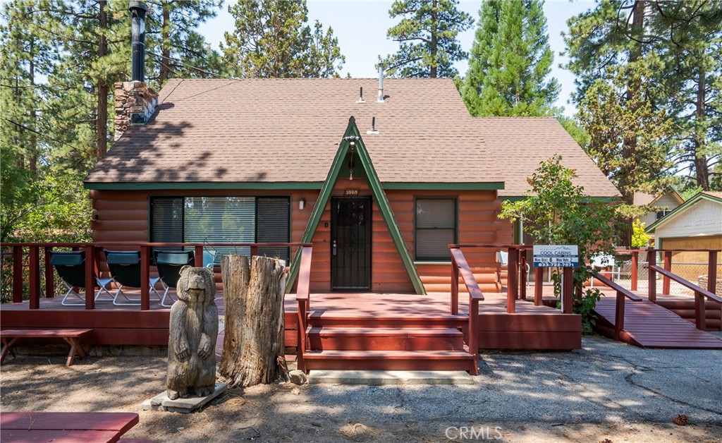 Every so often, a true classic cabin becomes available in Big Bear, and when they do, they’re quickly sought after. Fall in love with this charming mountain retreat, situated on a fully fenced lot. Start your day with a cup of coffee on the spacious new deck, surrounded by lush trees, offering a serene and peaceful atmosphere.
This beautiful Maltby cabin is located in a quiet, highly desirable neighborhood of Big Bear. Upon entering, you’re greeted by a cozy living room featuring the original Gold Mountain fireplace, providing warmth and comfort during the winter months. The cabin offers the perfect blend of charm and comfort with 2 bedrooms and 2 bathrooms. Preserving its timeless character, the home remains in its original condition, with stunning wood paneling in the bedrooms. Featuring: a flat 100% usable lot, room for 2 to 3 cars or a Boat or a combo of both, exterior paint recently weather proofed and Fully furnished!
The backyard is a true retreat, offering endless possibilities for relaxation and enjoyment. Whether you're hosting summer barbecues, lounging under the stars, or simply soaking in the peaceful mountain atmosphere, this space is perfect for creating your own personal oasis.
This is a rare opportunity to own a piece of Big Bear’s history—don’t miss out on making this iconic cabin your own!