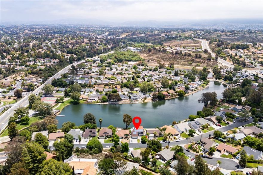 It’s rare to find a Temecula home where the lake feels like an extension of your living room, yet here it is. Perfectly positioned in Lake Village, this waterfront retreat captures sweeping reflections that stretch across the glassy water and into every main living space.



Inside, nearly 3,300 sq ft unfolds across three bedrooms and three-and-a-half baths, designed for easy living and memorable gatherings. Upstairs, the primary suite invites quiet mornings with lake views, a walk-in closet, en suite bath, and access to a light-filled sunroom that feels like a private perch above the water. A second en suite bedroom shares that view, while the third bedroom is ideally placed near a full hall bath. 



Step outside to the multi-level deck, just steps from the shoreline and enjoy ultimate place for dinners al fresco, coffee at sunrise, or Temecula’s famous 4th of July fireworks mirrored across the lake.



Practical perks make this home easy to love long-term: leased solar (approx. $188/mo through 2036), low HOA ($110/mo), and low property taxes (~1.03%). The Lake Village community offers pool, clubhouse, tennis, and fishing, plus one of the area’s most convenient locations.  Just minutes to Old Town Temecula, the freeway, and Wine Country.



Lakefront living like this doesn’t stay secret for long, so schedule your private tour today.