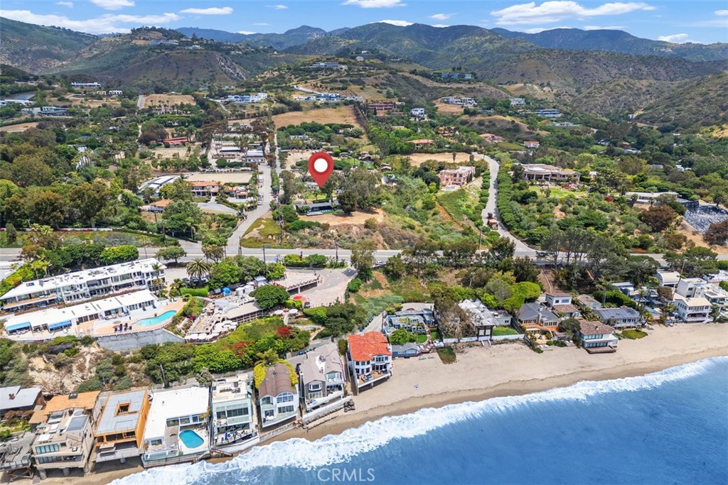 Welcome to The Bluff Side Four, an exceptional and rare opportunity to own one of Malibu’s most unique blufftop compounds. Spanning two legal parcels and totaling two acres of flat, prime coastal land, this private estate features FOUR beautifully remodeled homes, each with its own distinctive style and purpose. Perched above the Pacific Coast Highway and directly across from the iconic Geoffrey’s Restaurant, the property boasts panoramic ocean views that stretch from Palos Verdes to Point Dume, offering a breathtaking backdrop for coastal living.
Each of the four residences was fully renovated just two years ago and is currently tenant-occupied, generating strong income and presenting a dream scenario for investors, 1031 exchange buyers, or those seeking a blend of lifestyle and revenue. The homes include: the Sunset House, a 3-bedroom, 2-bath home with 1,585 sq ft of stylish interior space and sweeping views; the Sea View House, offering 1,689 sq ft across 2 bedrooms, 2.5 baths, and an attached 1 bed, 1 bath ADU —giving multiple living options and flexibility, also with sweeping views; the Tree House, a cozy 1-bedroom, 1-bath loft retreat with 597 sq ft, nestled among lush landscaping; and the Garden Cottage, a charming 440 sq ft 1-bedroom studio with a full kitchen and living room, with a private courtyard and garden area
This property is unique and special in so many ways. It is rare to find a piece of flat land, on a bluff, with unobstructed views this close to the water. Short-term rental permits are available and transferable, allowing for both long-term stability and short-term rental flexibility. Centrally located on PCH between Malibu CanyonRd and Kannan Rd allows for easy access to the 101 freeway. The property is minutes away from Pepperdine University, Zuma Beach, and the Iconic Malibu Pier, and steps away from Escondido Beach and Paradise Cove, with easy beach access. Whether you choose to live in one home and lease the others, continue operating it as a high-yield income property, or take your time developing a custom estate while generating income during the permitting process, the potential here is truly limitless.
This is more than just a Malibu property—it’s a once-in-a-lifetime opportunity to own a legacy estate on one of the most iconic stretches of California coastline. The Bluff Side Four blends luxury, location, income, and vision into one extraordinary offering. Don’t miss your chance to secure a piece of Malibu magic.