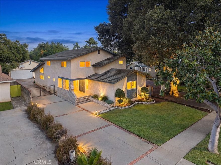 Located in one of Alhambra’s most desirable North-of-Main neighborhoods and set on a charming tree-lined street with wide, paved walkways on both sides, this beautifully updated home offers an exceptionally well-organized, highly functional, and wonderfully bright floor plan ideal for modern living. Bordering San Marino and North San Gabriel, the home rests in an exceptionally quiet and well-kept residential pocket with easy access to supermarkets, restaurants, retail, parks, and everyday essentials, providing outstanding convenience. This spacious two-story residence features two master suites, one on each floor, ideal for multi-generational living, extended family, or guests. The home has been substantially upgraded throughout, including a newer kitchen with updated cabinets and new appliances, plus a spacious breakfast area. Additional improvements include new laminate flooring throughout, new dual-pane windows, and newly remodeled bathrooms with modern, stylish finishes. The first-floor master suite features a brand-new full bathroom, while the second floor offers two newly updated bathrooms. In total, the home provides four bedrooms and three and a half bathrooms. A standout highlight is the impressive almost 700 sq.ft. family entertainment room, offering exceptional space for gatherings, children’s play, home office needs, or versatile multi-purpose use, an uncommon benefit in this neighborhood. The third garage and adjacent side area also provide excellent ADU potential for future expansion. Additional features include a full tile roof, central AC for year-round comfort, and a welcoming front patio that enhances the home’s curb appeal. Both the front and back yards are well-proportioned and easy to maintain, with a comfortable balance of green lawn and practical parking layout, ideal for buyers who want outdoor space without heavy upkeep. With fresh interior paint and thoughtful renovations, this move-in-ready home is an excellent choice for larger or multi-generational households seeking comfort, space, and exceptional convenience in a prime North Alhambra location. Come check it out and experience the difference, this home truly stands out from the typical Alhambra properties with its unique layout, brightness, functionality, and overall living quality.