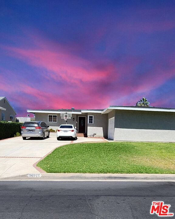 Welcome to 14975 Excelsior Dr, La Mirada! This stunningly upgraded home boasts an open and inviting floor plan filled with great natural light, with the dining area flowing seamlessly into the den and living room under dramatic exposed wood beam ceilings. Recent upgrades include quality tile flooring throughout, modern appliances, sleek countertops, new cabinets, recessed lighting, and a newly installed electric panel. Both bathrooms shine with refreshed showers and elegant fixtures, adding a spa-like touch. The private backyard offers lush greenery and lemon trees, creating a tranquil retreat. With RV parking, a 2-car garage, and an ideal location close to premier shopping, dining, entertainment, Biola University, and highly rated schools, this home perfectly blends luxury, comfort, and convenience.