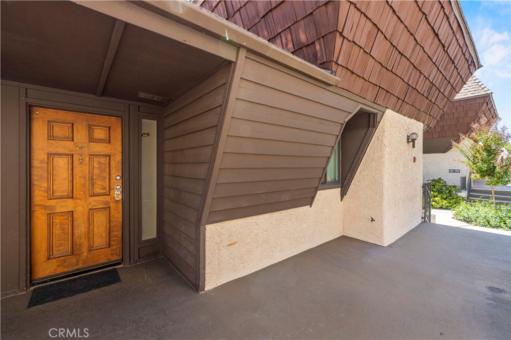 FHA & VA APPROVED COMMUNITY! Welcome to the desirable Parkwood Community, ideally located in the heart of Van Nuys. This residence is a rare find, offering one of the largest floor plans in the community!
Step into a warm entryway with a convenient landing area, leading to a stylishly remodeled powder room featuring a custom herringbone tile design and hardwood vanity with a quartz countertop.
The main level offers a generously sized bedroom complete with a custom built-in closet system. A light-filled living room with soaring ceilings seamlessly connects to the dining area, anchored by a sleek modern fireplace. From here, enjoy access to the enclosed porch—perfect for relaxing and enjoying fresh air.
The remodeled kitchen showcases quartz countertops, natural stone tile, and stainless steel GE appliances. A convenient laundry nook is tucked inside with newer GE and Maytag washer and dryer included.
Retreat upstairs to the oversized primary suite boasting two upgraded custom closets, a private secondary porch, and a spacious bathroom with dual sinks. The third bedroom is airy and inviting, offering its own custom closet and adjacent access to a full bathroom.
Thoughtful upgrades throughout include new recessed lighting, water-resistant laminate flooring, high-quality steel handrails, and all-new energy-efficient windows and doors.
Additional highlights include two covered tandem parking spaces with an oversized secured storage room, plus easy access to the unit. Community amenities include secure gated entry, pool, spa, gym, recreation room, water, trash service, and tons of visitor parking for added convenience for your guests. All this with easy access to major freeways, shopping, and dining. You will not want to miss this one!
