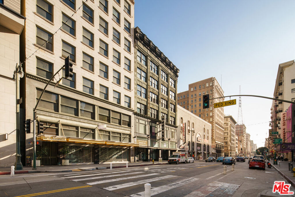 A rare investment opportunity in the heart of Downtown LA's Broadway Theatre District, The Judson is a fully restored 60-unit Beaux-Arts apartment complex offering historic charm with modern convenience. Unlike most DTLA properties, The Judson is NOT subject to local rent control, allowing for annual rent increases of 5% + CPI (currently 8.9%). Additionally, as a Mills Act property, it benefits from significant tax savings of approximately 50% annually. In 2006, the building underwent an $11 million renovation led by David Gray Architects, preserving its stunning Beaux-Arts design while modernizing interiors and infrastructure. The Judson consists entirely of market-rate, turnkey units, featuring high ceilings, polished concrete floors, stainless steel appliances, Caesarstone countertops, Italian cabinetry, recessed lighting, and oversized soaking tubs. Select units offer exposed brick, balconies, and city views. Amenities include a controlled-access lobby, two elevators, a skylight stairway, a recreation room, a gym, private storage, and a rooftop sundeck with a spa, BBQ area, and breathtaking LA skyline views. Parking is secured through a long-term agreement with the California Redevelopment Agency, providing 60 dedicated spaces at 333 S. Spring St. A recognized Historic-Cultural Monument and listed on the National Register of Historic Places, The Judson is surrounded by DTLA's finest restaurants, retail, and entertainment, making it an unparalleled investment opportunity in one of LA's most vibrant neighborhoods.