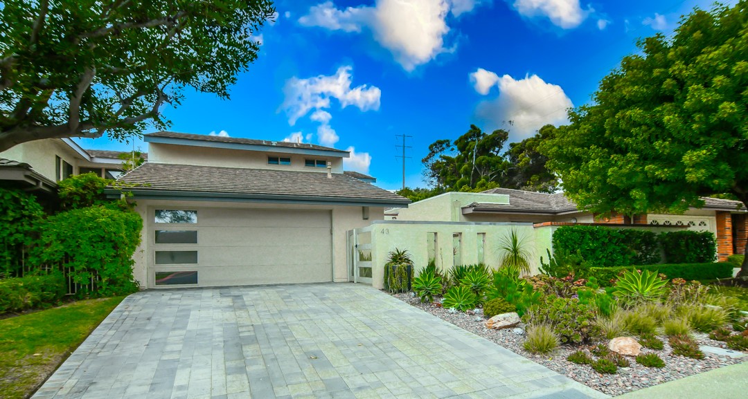 CUSTOM & CAPTIVATING CORONA DEL MAR
Large 3-bedroom 3-bath with over 2,550 square feet of living space ideally located in the prestigious resort community of Jasmine creek in the heart of Corona del Mar.
Unequal quality begins as you open the custom entry doors to the private door to the private interior entry of this totally redesigned and remodeled custom interior. Stone, tile, wood flooring throughout. Gourmet kitchen (see attached separate write up on the high-profile appliances) has a center island. Magnificent GREAT ROOM – living room with custom fireplace, dining room, gourmet kitchen and bonus room. Elegant powder room on this level. Custom lighting inside and out.
Love outdoor entertaining? Step out onto the private play area and sumptuous rear yard. Twin Eagles BBQ, refrigerator, outdoor heaters, fountain and Alliance outdoor lighting. There is a dining area and social gathering area. The atmosphere here is joyful.
The upper level houses the bedrooms and baths. The primary luxurious ensuite and two secondary bedrooms. Guest bedroom #1 has its own private deck to walk out and view a neighborhood park setting. Guest bedroom # 2 has a petite walk-in closet ideal as nursery, teen, workout, guest bedroom and/or artist studio. The hallway bath serves both secondary bedrooms.