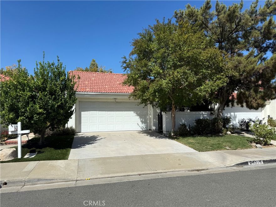 This charming single-story home is tucked away in the Valencia Summit - one of the most desirable neighborhoods, offering the perfect blend of comfort, style, and convenience. Inside, you’ll find beautiful wood flooring complemented by a bright interior. The home features 2 bedrooms plus a versatile office/den that can easily be converted into a 3rd bedroom to fit your needs. Large windows with wood plantation shutters fill the home with natural light while providing timeless style and privacy. Step outside to enjoy the home’s private courtyard and front patio—ideal spaces for morning coffee or evening relaxation. The backyard retreat features a paved walkway, a flourishing orange tree, and plenty of room to create your own landscaped paradise or weekend gardening oasis. Located in the prestigious Valencia Summit community, you’ll love the miles of paseos, scenic trails, and proximity to shopping, dining, and award-winning schools. No Mello Roos and low HOA includes Pool, Spa, Tennis Courts and so much more. Don’t miss your opportunity to own a beautifully maintained home in one of Valencia’s most treasured neighborhoods!