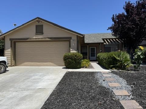 Welcome to this charming 3-bedroom, 2-bathroom home in the vibrant city of Hollister. With a spacious 1,080 sq ft layout, this residence offers a perfect blend of comfort and functionality. The kitchen is a highlight, featuring granite countertops, a gas oven, dishwasher, microwave, garbage disposal, and refrigerator, making it a culinary enthusiast's dream. The home boasts a range of desirable amenities, including vaulted ceilings that add a touch of elegance to the living spaces. Flooring throughout the house includes carpet, laminate, and tile, providing variety and ease of maintenance. Stay comfortable year-round with central air conditioning and ceiling fans, while the central forced air heating ensures warmth during cooler months. Enjoy cozy evenings by the fireplace, and take advantage of the convenient laundry area. The property is situated within the Hollister Elementary School District. With a 2-car garage, this home combines practicality and convenience, making it an ideal choice for those seeking a welcoming residence in Hollister.