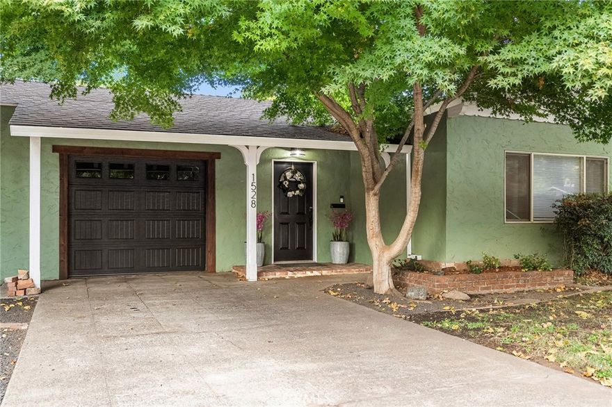 Two units on one property! This Chico gem features a 3 bedroom, 1 bathroom main house (1,301 sq. ft.) plus a beautifully remodeled 450 sq. ft. studio unit—perfect for multi-family living, rental income, or guest accommodations.



Inside the main home, you’ll be welcomed by a bright living room with white-painted exposed beam ceilings that add charm and character, paired with a cozy wood-burning fireplace for a warm and inviting atmosphere. The open layout flows into the dining space and kitchen, where you’ll find abundant cabinet storage and a large window over the sink. The primary bedroom includes a spacious walk-in closet, while the bathroom offers a unique clawfoot tub. Two additional bedrooms provide space for family, guests, or a home office. Modern upgrades include new luxury vinyl flooring, a newer roof, and a newer A/C unit, making this home move-in ready with room to add personal touches.



The private studio, remodeled in 2021, includes a full bathroom, range, refrigerator, stackable washer and dryer, newer flooring, fresh interior paint, a mini split system for heating and cooling, and its own fenced yard with separate entrance.



The property sits on a spacious lot with a true park-like setting. Outdoors you’ll find multiple sitting areas, raised garden beds, mature trees (including olives), a firepit, and string lighting for evening ambiance. A shed offers additional storage, while the shaded patio and large lawn provide plenty of space to relax or entertain.



Located just minutes from shopping, Chico State, and great restaurants, this property blends comfort, charm, and flexibility—whether you’re looking for a family home with guest space, or a smart investment opportunity.