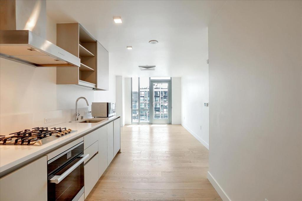 This 1-bedroom home in the heart of San Francisco is your new oasis in the city! Enjoy living in an amenity-filled community near everything you love! Welcome home to a bright open floor plan with oversized windows overlooking city views, central air conditioning, hardwood floors, and sophisticated interiors! Soak up the sun on your private balcony, perfect for morning coffee. Cook up a storm with ease in your gorgeous gourmet kitchen, complete with endless cabinetry, under-cabinet lighting, and seamless built-in appliances! Concealable in-unit laundry machines were also installed for ease of chores. Enjoy private relaxation in the huge bedroom, with a walk-in closet ready for your entire wardrobe. Sleek full bathroom comes with a glass-enclosed shower with floor-to-ceiling tiled backsplash. Your new home is in the Austin, a vibrant neighborhood that lets you access world-class amenities such as a rooftop terrace with panoramic city and bay views, a lounge with a courtyard, elegant lobbies, and a package room. Conveniently located near Whole Foods, Trader Joe's, Lafayette Park, transportation, and an abundance of shops and eateries! *Garage parking is available from the building for an additional fee. Message us for more details. Pet Friendly Pet Deposit - $500