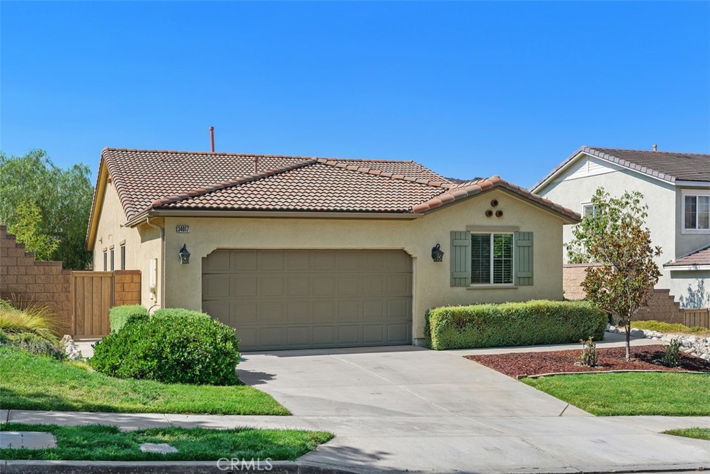 Welcome to 34017 Corktree Rd in the Canyon Hills community of Lake Elsinore. This bright single-level home has an open-floor plan, a freshly painted interior, and all-new LED lights. It features three bedrooms, two bathrooms, and a versatile space that can be transformed into an office, a formal dining room, family room or even a fourth bedroom. The primary room includes a walk-in closet, double sinks, and a relaxing soaking tub. The kitchen has granite countertops, an island perfect for entertaining, and seamlessly flows into the living room. Step outside through the sliding doors to a covered patio that offers a serene view of the mountains. The backyard is meticulously maintained and features a fig tree, a jujube tree, and an olive tree. Conveniently located near elementary and middle schools, this home offers resort-style living amenities such as a clubhouse, three pools, a splash zone, a community park, a sports park, and proximity to shopping, dining, and entertainment! A must see.