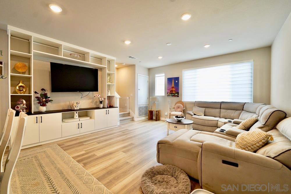 Experience luxury living at Cabrillo at Ponte Vista! This beautifully upgraded 4BR/4BA townhome offers designer touches throughout—luxury vinyl flooring, custom built-ins, and high-end, energy-efficient appliances. As you enter through a gated, sunlit patio, you’re welcomed into the entry level featuring a private bedroom and full bath—ideal for guests or a home office. On the main level, enjoy open concept living with a spacious kitchen, dining area, and balcony, perfect for seamless indoor-outdoor entertaining. Upstairs, you’ll find full-size laundry, generously sized secondary bedrooms, and a luxurious primary suite with a large walk-in closet and spa-like bath. Smart home features include paid solar, WiFi-enabled thermostat, smart locks, garage opener, and motion sensors. Resort-style amenities in this gated community include a pool, spa, fitness center, BBQ area, and clubhouse. All just 5 miles from the Pacific Ocean and minutes from top-rated schools, golf, shopping, dining, and coastal recreation! Built with modern living in mind, this tri-level townhome offers the perfect blend of style, space, and smart technology. The flexible floor plan provides privacy for multigenerational living or a work-from-home lifestyle. Enjoy the benefits of fully paid solar and energy-efficient systems, helping reduce utility costs. The attached two-car garage provides direct access, and the community’s gated entry ensures peace of mind. Residents love the walkability to green spaces and the convenience of being just minutes from the 110 freeway, local parks, and the vibrant waterfront. Significant interior upgrades add exceptional value and functionality, including: 1. California Closets built-in living room audio/visual bookcase, 2. Murphy bed with integrated work desk, 3. Custom laundry cabinet shelving and storage, and 4. Primary bedroom built-in closet organizer and dresser with an elegant built-in jewelry case. Enjoy pure, pH-balanced water throughout the home with a premium Nuvia whole-house water filtration system, along with a dedicated under-sink alkaline water infusion system in the kitchen—offering both luxury and health-conscious convenience. These high-quality additions enhance both everyday living and long-term value, offering comfort, efficiency, and refined design throughout.