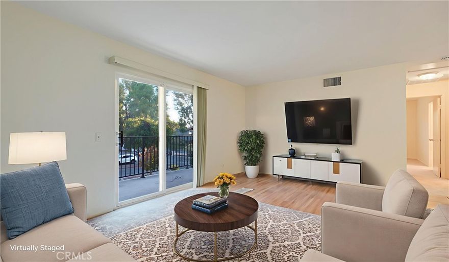 Welcome to this charming Murrieta Villas condominium! With two bedrooms and two bathrooms, this lovely upstairs unit boasts 993 square feet of living space, a private front-facing balcony and an attached garage. The entryway welcomes you at ground level, where a staircase leads to the main living area on the second floor. At the top of the stairs, natural light fills the living room from the sliding glass door to the private balcony, highlighting the combination of carpet and tile flooring and the light, neutral paint scheme throughout. Beyond the living area, the well-appointed kitchen, dining space, bedrooms and bathrooms await. The kitchen offers ample counter and cabinet space, along with a convenient in-kitchen laundry area. You will also find a 5 burner electric stove and oven, dishwasher, built-in microwave, and a window over the sink that fills the space with natural light. Down the hallway, you will find a spacious walk-in closet with built-in shelving for easy organization. The hallway bathroom features a shower/tub combination, tile flooring, and a single sink vanity. The master bedroom is complete with plush carpeting, a closet with three sliding doors, a ceiling fan for comfort, and a window that bathes the room in natural light. The attached master bathroom boasts tile flooring, single sink with a vanity sitting area, and a shower/tub combination. Equally welcoming, the additional bedroom has plush carpet flooring, a closet, a ceiling fan, and a window. Conveniently located, this home provides easy access to shopping centers, freeways, and highways, striking a harmonious balance between comfort and accessibility.