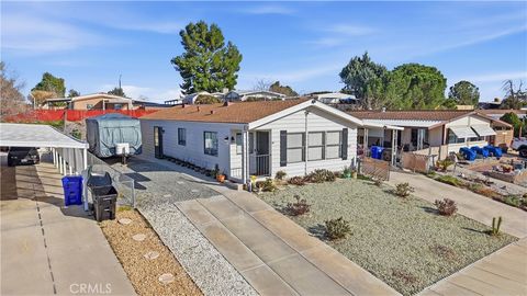 Photo of 13877 Tam O Shanter Drive, Victorville, CA 92395 (MLS # HD26038676)