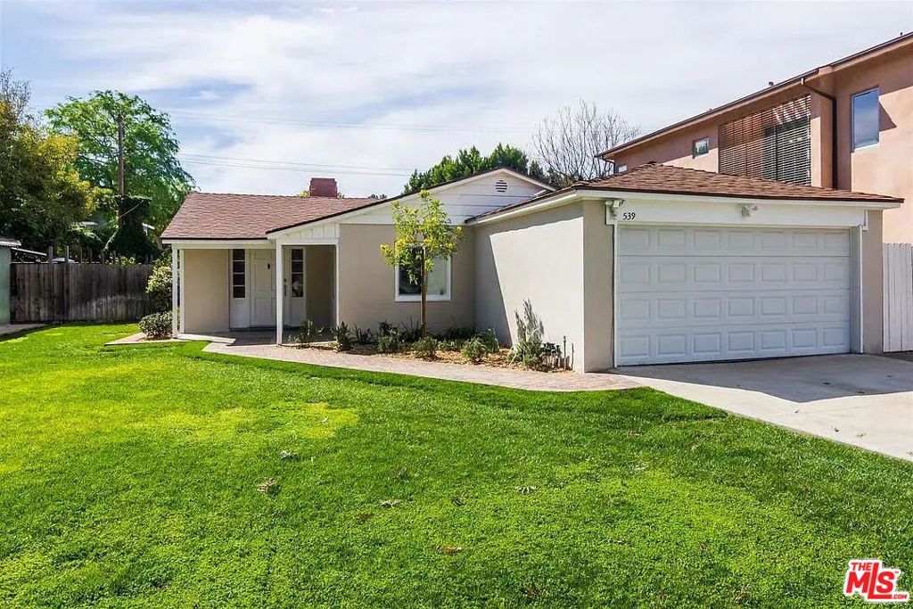 This beautifully updated home blends timeless character with modern upgrades, creating a perfect retreat in the heart of the Rancho District, one of Burbank's most sought-after neighborhoods. Step inside to find a thoughtfully remodeled kitchen and bathrooms, designed with both style and functionality in mind. The inviting living room features a cozy fireplace while large windows fill the space with natural light. Outdoors, enjoy a spacious grassy yard perfect for entertaining, play, or gardening. A raised planter box offers the ideal setup for those with a green thumb. Situated very close to major studios, Magnolia Park, and the Los Angeles Equestrian Center, and top-rated schools, this home places you at the center of Burbank's vibrant community.