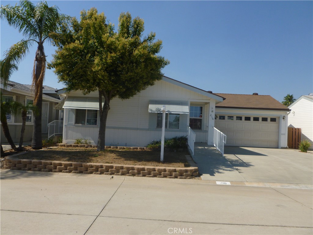 Located in the gated 55+ community of Sun Meadows. Home features 2 car garage with enough room to park 4 cars on driveway. Lots of storage units in garage. Dining are off of living room. 2 bedrooms & 2 baths. Inside laundry room with set-tub and solar lighting. Plank flooring in entry, living room, & hall way. Kitchen has sheet vinyl flooring plus a freestanding gas stove, new microwave plus breakfast bar. Home features concrete ramp up to front door for easy access. Primary bedroom has large walk-in closet with solar light. Double sinks in primary bath with shower & tub & storage cabinet. Hall bath has shower and storage cabinet. Fullly fenced backyard with covered patio in backyard. Park has clubhouse, pool, sauna, game room & pool table. Lots of community activities for that active senior.