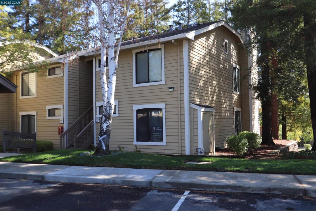 Opportunity - Muirwood -Square. Charming 1-Bedroom, 1 bath, 680 square foot condo. Own your first home in the most spectacular location! This corner lower unit is surrounded by Redwoods, new carpet, some fresh paint and ready to move into now with a dinette area, family room with a fireplace, large patio with views and this location in Martinez is close to scenic walking trails. The bathroom has a tub/shower combo, and the bedroom has a walk-in closet. The Kitchen with fresh painted cabinets has an electric stove/oven, microwave, refrigerator and dishwasher. Enjoy the convenience of in-unit laundry with a stackable washer and dryer in a closet. The well-managed HOA offers a pool, spa, and includes one assigned covered parking space plus plenty uncovered guest parking and covers water, sewer, trash, and exterior maintenance, giving you incredible value. Just two blocks from Muir Station with Nob Hill Foods, Starbucks, and the Contra Costa Stadium Cinema. Easy freeway access makes commuting simple. Don’t miss this opportunity to call this inviting space Home Sweet Home!