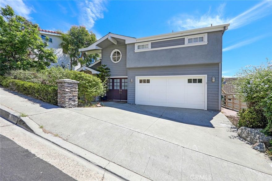 Centrally located in the Portafina area of Laguna Beach. Just a few blocks to Victoria Beach where you can enjoy easy access to restaurants, shopping and all that Laguna has to offer. This nicely updated and well-maintained home backs to open space and has good ocean and canyon views. The main floor has a great room concept with the kitchen open to the dining and living areas with ocean views. The chef's kitchen offers abundant counter space and storage. Upstairs the master suite has a separate sitting area where you can enjoy Catalina sunsets, and both secondary bedrooms have ocean views. The 3rd bedroom has built-ins in place of a closet and has been used as an office. The large rear deck is great for entertaining or spending a quiet afternoon getting some sun.