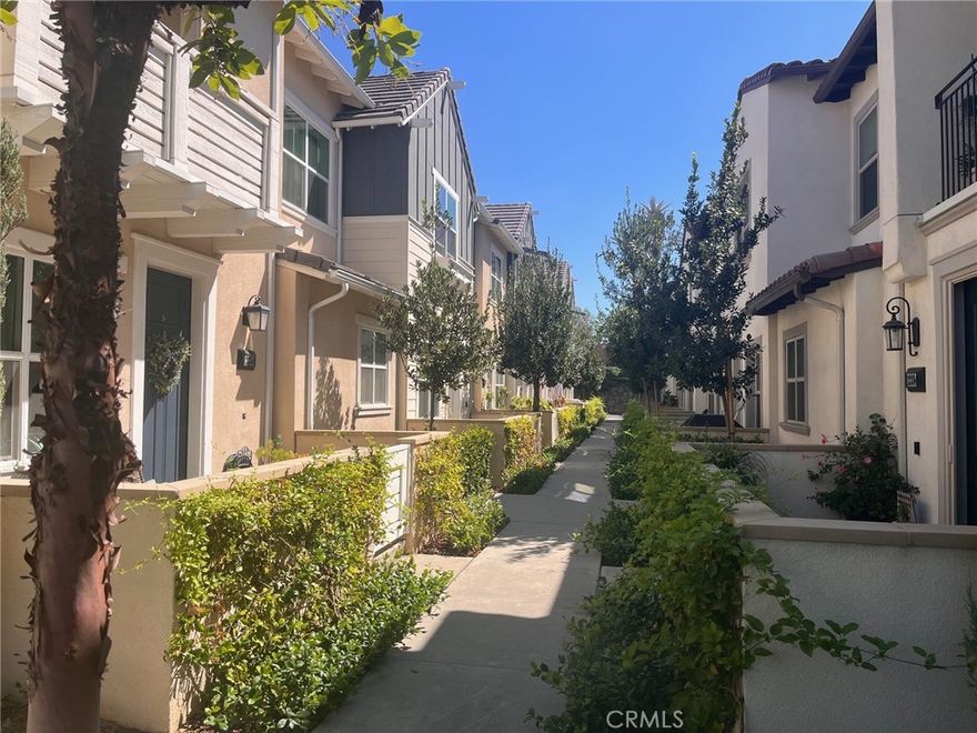 Sharp condo in the desirable, newer-built community of The Groves. Nestled in a quiet location with walkable streets, this home offers both charm and convenience, with a recently developed shopping center just steps away.

Inside, you’ll find an open and bright kitchen with a spacious island that seamlessly connects to the inviting family room—perfect for entertaining. The main level also includes a convenient half bath, laundry area, and direct access to an oversized two-car garage.

Upstairs, two private suites await. The primary suite boasts dual walk-in closets and a generously sized bathroom with double sinks and a separate shower. The secondary bedroom also features its own bath and walk-in closet, offering comfort and privacy for guests or family members. The garage offers an EV charger. Enjoy the outdoors on your welcoming front patio—perfect for morning coffee or evening unwinding—and take advantage of the many HOA amenities, including a sparkling pool, relaxing spa, playground and the beautifully restored historic red-brick Clubhouse, which showcases the grandeur of years past and offers rentable rooms for all occasions.