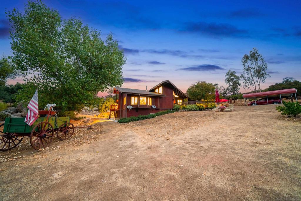 Welcome to Your Private Oasis in Jamul, California! Set on 2.85 acres, this 2,680 sq. ft., single level home offers 3 bedrooms, 2.5 bathrooms, a huge workshop and the perfect blend of modern comfort and serene living. The open layout features a spacious living area w/ fireplace, kitchen & dining. A large master bedroom & bathroom your very own walk-in closet. Vaulted ceilings in the main living space. Custom 30'x36' Workshop/shed with roll up door. 2 Private wells for all of your watering needs. Bring your family, room to add an ADU. Perfect for family compound. Zoned A72 with "0" designation gives this property plenty of options. Captivating mountain views, lush trees, and plenty of space to add on.