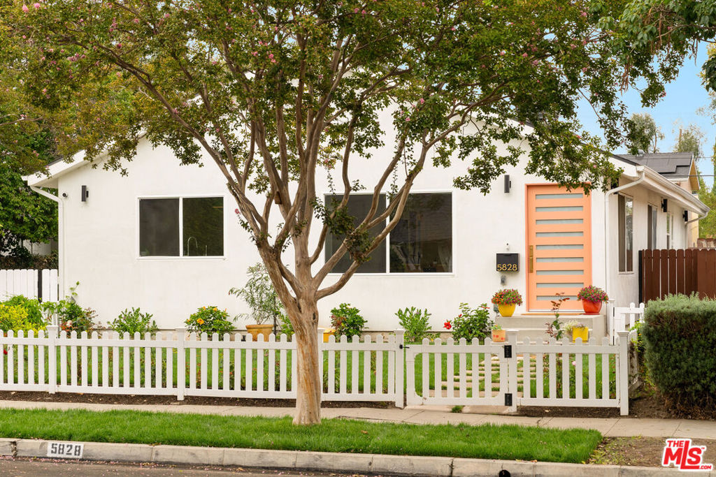 Welcome to this extraordinary modern residence, featuring a fully remodeled ultra-chic 3-bedroom, 3-bathroom home, a spacious new ADU, and a luxurious pool. Nestled on a picturesque, tree-lined street, this turnkey property seamlessly fuses contemporary style with easy, comfortable living.  Step inside to discover an airy and open-concept floor plan awash in natural light, flowing in through expansive windows and stunning skylights. The chef's kitchen is truly a culinary dream, equipped with premium Thermador stainless steel appliances, butcher block counters, a grand island with bar seating, and a walk-in pantry designed for ample storage. The spacious primary suite offers a private sanctuary complete with a walk-in closet and ensuite bathroom. Indulge in luxury with a dual sink vanity, a glass-enclosed shower, and a sumptuous soaking tub. Two additional well-appointed bedrooms share a stylish full bath. Venture outside to find an entertainer's paradise. The backyard is a welcoming oasis, showcasing pristine green turf, a Trex deck, and a sparkling new pool with spa, Baja shelf, and convenient outdoor shower. Multiple lounging and recreation areas invite endless enjoyment. Moreover, the property includes a large fully permitted ADU with its own kitchen, laundry, and spacious bathroom, ideal for hosting family and guests or generating rental income. Additional features of this gem include a charming powder room, easy access attic storage, laundry closet, dual-paned windows, solar panels and EV charger. The down-to-the-studs meticulous remodel boasts updates such as a new roof, updated electrical and plumbing, tankless water heaters, and a new central HVAC system with Nest thermostat. Conveniently located near major thoroughfares, metro station, studios, shopping centers, and local eateries, this perfect compound embodies the essence of easy, classic California living at its finest. Welcome home!