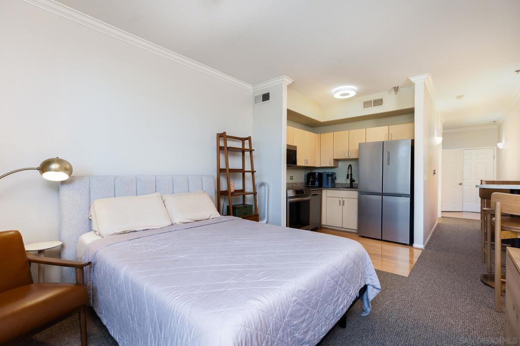 Welcome to this stylish and contemporary urban studio, perfectly situated in the vibrant heart of downtown San Diego. Enjoy breathtaking ocean views from your window while taking advantage of the city’s endless amenities just steps away. This residence offers the convenience of an assigned garage parking space, with ample street parking options nearby for guests. Step inside to discover a thoughtfully designed space, featuring modern, upgraded appliances that elevate your culinary experience. The expansive bathroom provides a spa-like retreat, and the generous closet offers ample storage for all your essentials. The building itself is impeccably maintained, offering residents access to a state-of-the-art fitness center. Whether you’re grabbing a coffee at a local café, strolling through scenic streets, or enjoying the nightlife, this highly walkable location ensures you’re always connected to the best that San Diego has to offer.