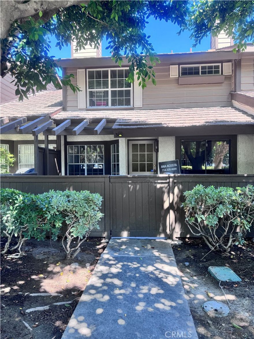Welcome to your 2-MASTER bedroom, 2 1/2-bath condo nestled in a peaceful community just steps from Disneyland. Each bedroom has its own private bathroom. The master bedroom offers tranquil views of the surrounding trees. With fresh paint and brand-new carpet on the stairs and in the bedrooms, this home is ready for immediate occupancy and eager to welcome its new owner. Providing comfort and convenience for everyone, you'll love coming home to a relaxing front patio surrounded by trees and overlooking a sparkling association pool—your retreat at the end of the day.

Additionally, on the side of the condo, you'll find a tennis court and a pickleball court for entertainment, along with a spacious attached 2-car garage for added convenience. Beyond the walls, the location is unbeatable. You are within walking distance of Disneyland and surrounded by world-class entertainment, dining, and shopping. Explore the vibrant Anaheim Packing District,