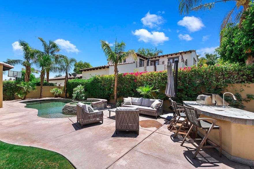 Spanish Villa    Come unwind and relax in this lovely, private 4-bedroom vacation home, where no detail has been spared.  Turnkey furnished with harmonious outdoor and gracious indoor spaces that blend and function as a great family getaway.    The Chef's kitchen has top of the line appliances and large serving areas, and wet bar! There is a separate dining area inside and a large eating area outside also!  The outside area bar and large firepit provide more areas to enjoy entertaining! There are Two guestrooms with king beds, and 2 guestrooms with queen beds. Upstairs, there is a large family or games room.  All TVs are smart TV'sLeased from Jan 1 2024 - May 15 2024.  Available all other months.  Please call for pricing.