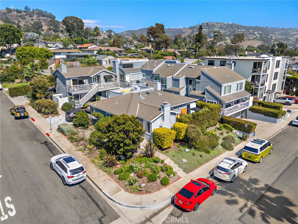 Discover the heart of Laguna Beach from this 2 bedroom, 2.5 bath coastal beach cottage—just steps from the sand, art galleries, shops, and cafés. With approximately 1180 sq ft, this home offers comfortable open living and dining areas designed for ease of coastal living. The kitchen features new stainless appliances, flowing into a main level living space with a fireplace and a convenient powder room. Upstairs, two spacious bedrooms, primary en suite bath, a second full bath and ample storage. There is a permitted loft with skylight and pull down stairs for access. The loft is a great option for an artist studio. Rare for the area, this home includes a detached two car garage with room for storage. Recently refreshed, it has new paint, new windows, new HVAC, repiped with Pex and so much more. The 6 unit community has a private Jacuzzi. With a Walk Score of 86, everything you love about Laguna—Walk to Main Beach, Heisler Park, downtown dining, and the vibrant art scene—is just around the corner. Whether you’re seeking a full-time retreat or lock-and-leave getaway, this property embodies the best of walkable coastal living. Live the good life in Laguna Beach!