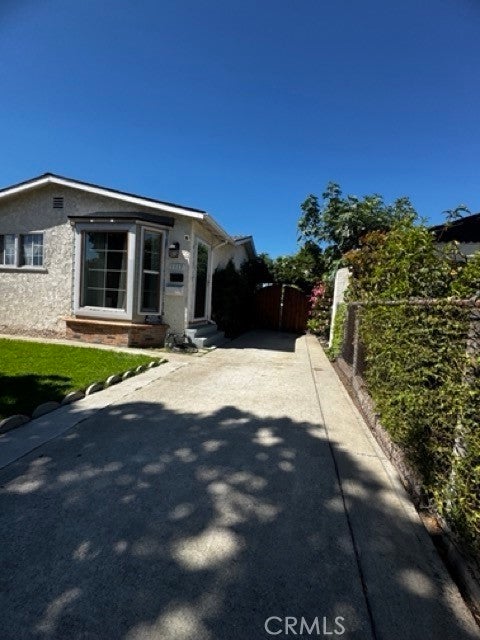 Photo of 1115 E 105th St, Los Angeles, CA 90002 (MLS # DW26072852)