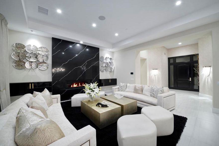 This home was completed on August 30, 2020.  It is brand new and decorated impeccably.  The street presence with the iron gate entry, 3 car garage, lavish landscaping, and beautiful walkway are simply the beginning. As you enter,  the white porcelain tiles,  the lush white flowers, stunning black flowered pots, each are unique.  The private and detached casita has a living room, kitchenette, and king size bedroom, with a custom walk in closet, and double vanities, highly upgraded shower and gorgeous cabinetry.  White shutters on the door and windows enable your guests to sleep in comfortably. The main entry begins with gorgeous art and sconces to a living room/dining room combination which all look to the beautiful golf course view.  Pocket doors open in the living room to give you indoor outdoor lifestyle.  A sit down bar with stunning porcelain is perfectly situated next to the dining, living, family and kitchen. There are built in cabinets throughout the home and custom built his and her large master closets. The living room is breathtaking with the black and white porcelain fireplace wall.  The master suite is separate from the 2 guest suites each with their own ensuite.  Each ensuite has the double vanities and beautiful cabinetry. There are simply too many upgrades and gorgeous lighting and chandeliers to mention. As gorgeous as the inside is the outside is a place you will not want to leave.