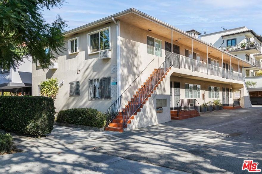 Discover charming West Hollywood living in this spacious upper-level 1-bedroom, 1-bathroom apartment. Located in a well-maintained 8-unit building, this unit provides a peaceful retreat while placing you just moments from the best shops, cafes, and everyday conveniences the neighborhood is known for. Inside, the unit features real hardwood flooring, elegant crown moulding, and beautiful wainscoting throughout, creating a warm and refined atmosphere. The generous living area flows into a well-appointed kitchen and dining area, equipped with stainless steel appliances, including a refrigerator and range with hood, plus a microwave and garbage disposal. The bedroom includes a large cedar-lined closet and an air-conditioning unit for personalized comfort. The bathroom is clean, bright, and updated with contemporary fixtures. Water and trash are included in the rent. One parking space is available for an additional fee. With a Walk Score of 95, this prime location places you moments from Trader Joe's, Sprouts, Target, Starbucks, and the countless dining and entertainment options West Hollywood has to offer. Easy access to public transportation makes commuting throughout Los Angeles simple and convenient.