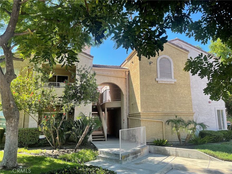 Welcome to 2400 Del Mar Way, Unit 208, nestled in the sought-after Sierra Del Oro community in Corona, just 5 miles from Yorba Linda. This ready-to-move-in end unit offers a perfect blend of comfort and convenience on the top floor with no neighbors above. Enjoy the luxury of a rare 1-car detached garage, plus a carport and an assigned parking space. Step inside to discover a stylish living room with vaulted ceilings and a cozy fireplace, offering easy access to your private balcony. The space is adorned with modern laminated planks throughout, creating a warm and inviting atmosphere. The kitchen is a chef's delight, boasting granite countertops, a breakfast bar, and newer appliances, along with a stackable washer, dryer, and pantry for added convenience. There is also a breakfast Nook. The primary bedroom is a serene retreat with a spacious walk-in closet and an en-suite bathroom. The secondary bedroom also features a walk-in closet and access to the balcony, where you can enjoy a peekaboo view of the city lights. Community amenities are plentiful, including a refreshing swimming pool, a relaxing spa, an exercise room, a clubhouse, and sports courts, all designed to support an active lifestyle. Additionally, the monthly rent includes water, trash, and HOA fees, making it a convenient choice for your next home. The home's location is unparalleled, offering seamless accessibility to Orange County's vibrant offerings and to major transportation arteries nearby, including the 91 Freeway and FasTrak, 241 Toll Road, and Metrolink. Don't miss out on this exceptional opportunity to live in a vibrant community at the foothills of the Santa Ana Mountains. Move in on or after November 21, 2025.  Schedule your viewing today and make this charming unit your new home!